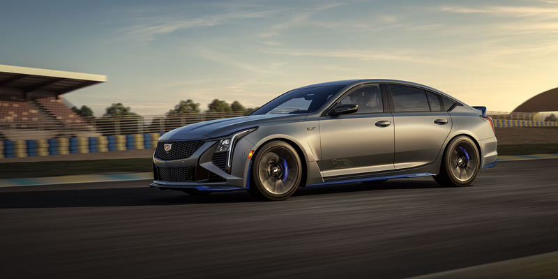 A gray 2025 Cadillac CT5-V driving down a paved road