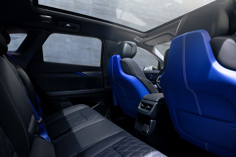 Back Seat View of the 2026 OPTIQ-V Blue Front Seats, Sun Roof, and Interior | Schwan Cadillac in Mandan ND